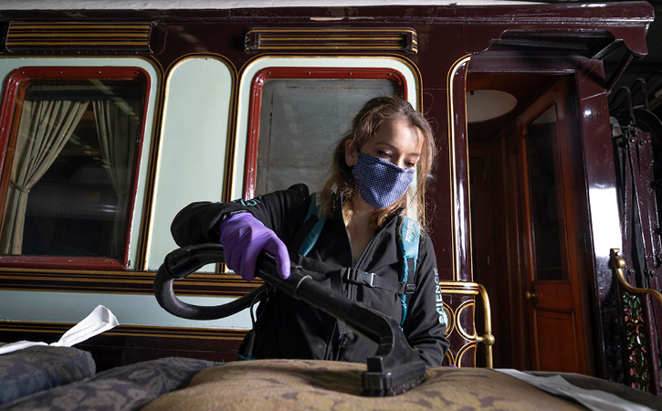 woman cleaning exhibition at Locomotion Museum